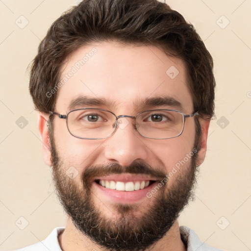 Joyful white young-adult male with short  brown hair and brown eyes