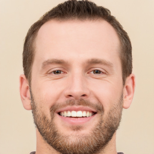 Joyful white young-adult male with short  brown hair and brown eyes