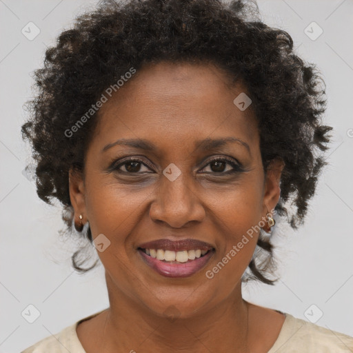 Joyful black adult female with short  brown hair and brown eyes