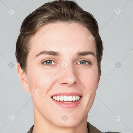 Joyful white young-adult female with short  brown hair and grey eyes