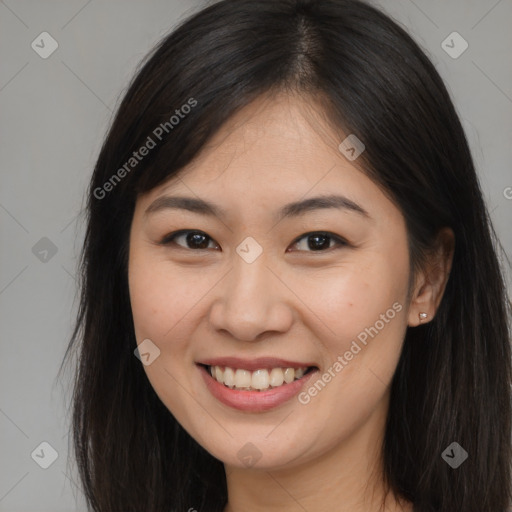 Joyful asian young-adult female with long  brown hair and brown eyes