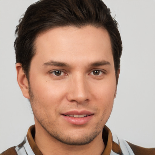 Joyful white young-adult male with short  brown hair and brown eyes