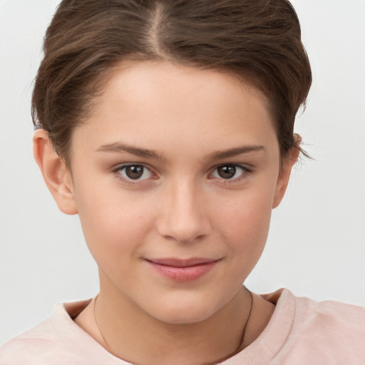 Joyful white child female with short  brown hair and brown eyes