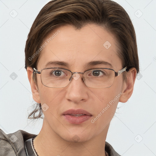 Joyful white adult female with short  brown hair and grey eyes