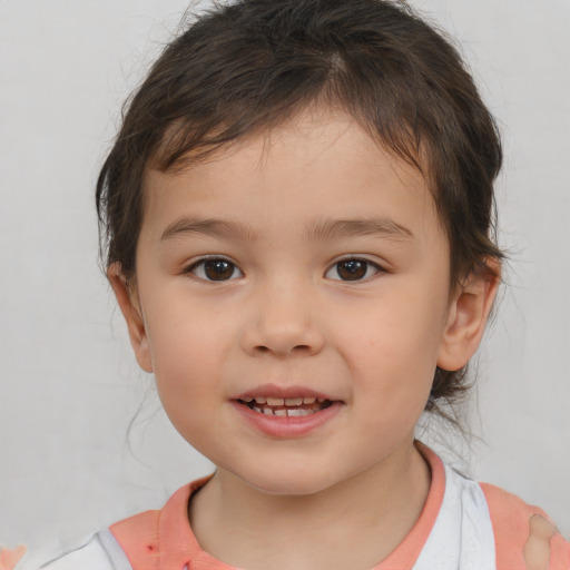 Joyful white child female with short  brown hair and brown eyes