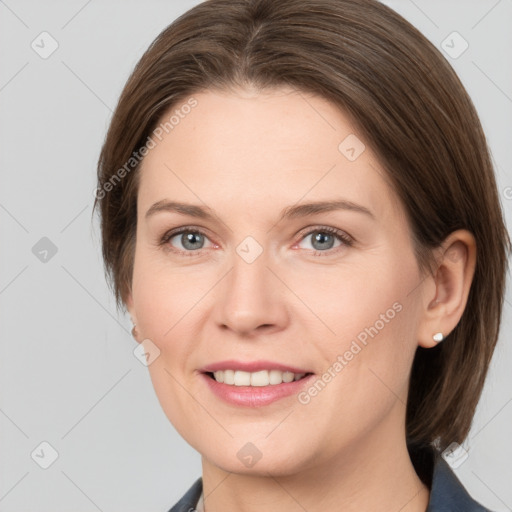 Joyful white adult female with medium  brown hair and grey eyes