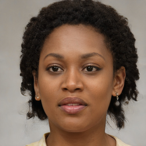 Neutral black young-adult female with medium  brown hair and brown eyes
