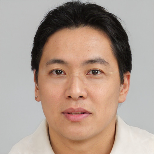 Neutral asian adult male with short  brown hair and brown eyes