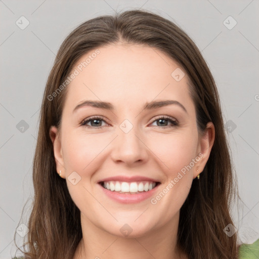 Joyful white young-adult female with long  brown hair and green eyes