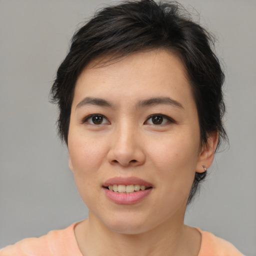 Joyful asian young-adult female with medium  brown hair and brown eyes