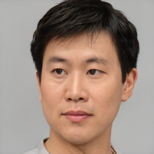 Neutral asian young-adult male with short  black hair and brown eyes