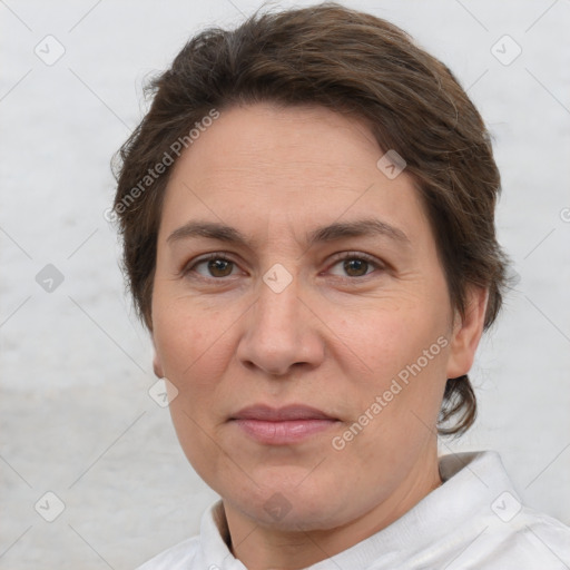 Joyful white adult female with short  brown hair and brown eyes