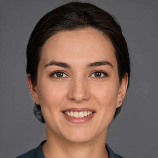 Joyful white young-adult female with medium  brown hair and brown eyes