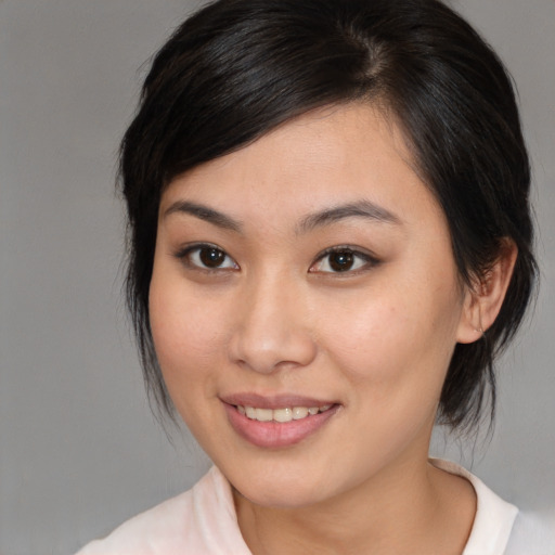 Joyful white young-adult female with medium  brown hair and brown eyes