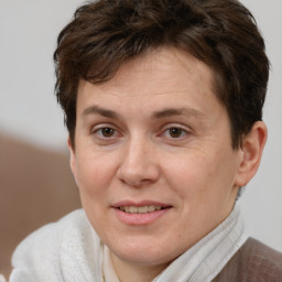 Joyful white adult female with short  brown hair and brown eyes