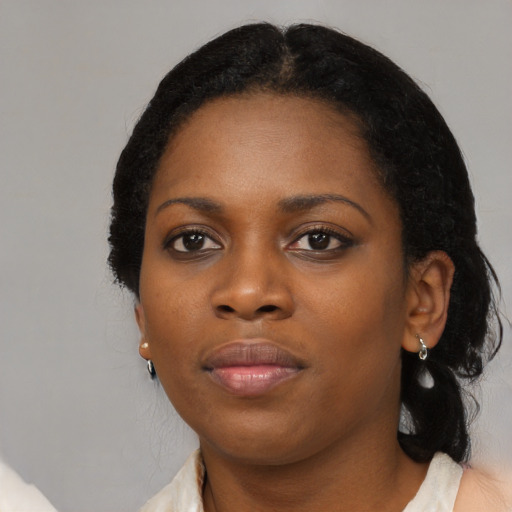 Neutral black young-adult female with medium  black hair and brown eyes