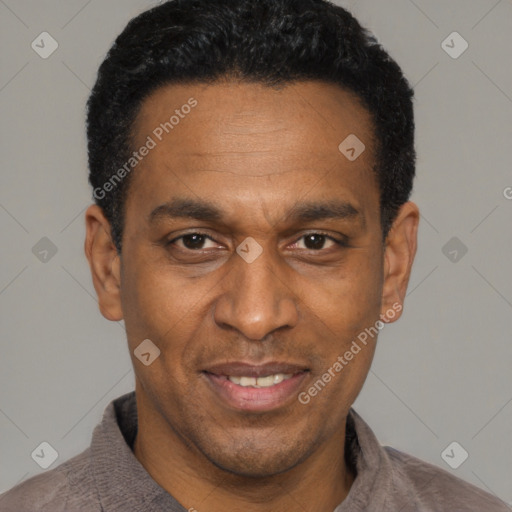 Joyful latino adult male with short  black hair and brown eyes