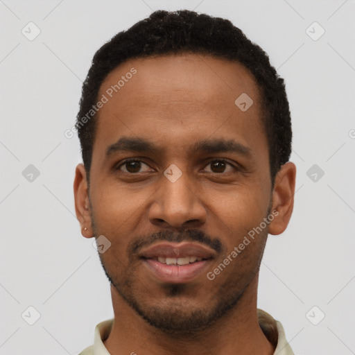 Joyful black young-adult male with short  black hair and brown eyes