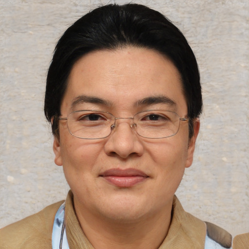 Joyful asian adult female with short  brown hair and brown eyes