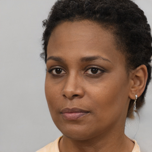 Neutral black young-adult female with short  brown hair and brown eyes