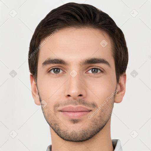 Joyful white young-adult male with short  brown hair and brown eyes