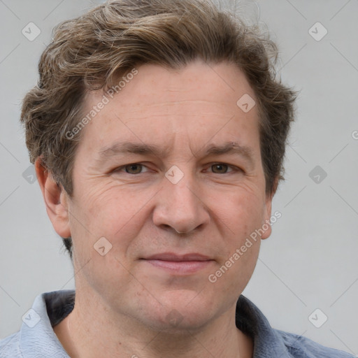 Joyful white adult male with short  brown hair and grey eyes