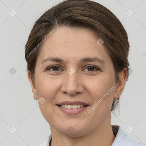 Joyful white adult female with short  brown hair and grey eyes