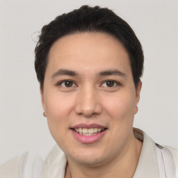 Joyful white young-adult male with short  black hair and brown eyes