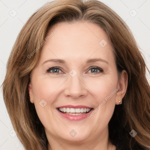 Joyful white adult female with long  brown hair and brown eyes