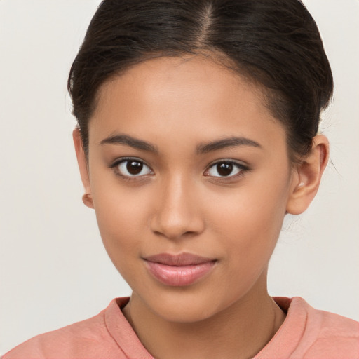 Joyful latino young-adult female with short  brown hair and brown eyes