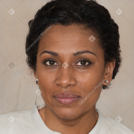 Joyful black adult female with short  brown hair and brown eyes
