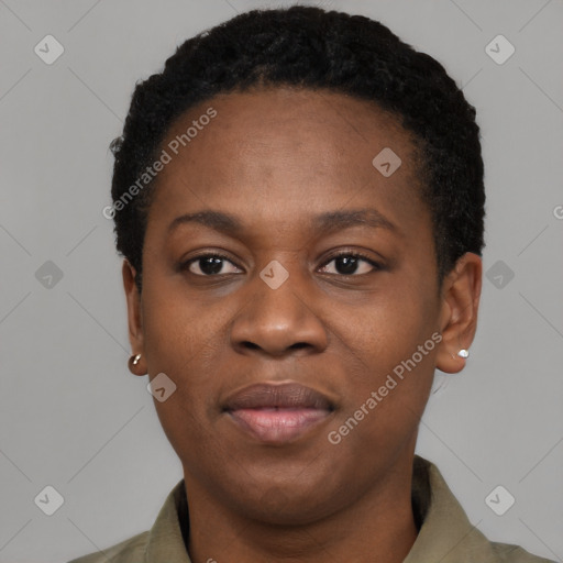 Joyful black young-adult female with short  black hair and brown eyes