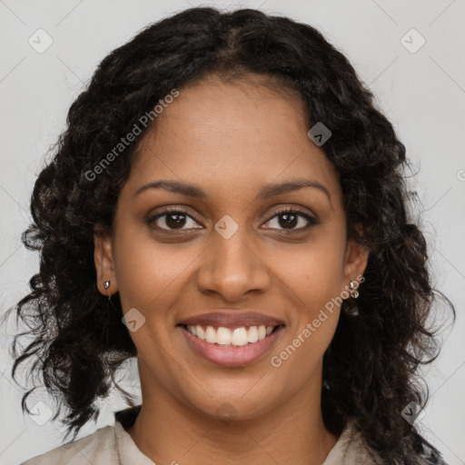 Joyful black young-adult female with long  brown hair and brown eyes