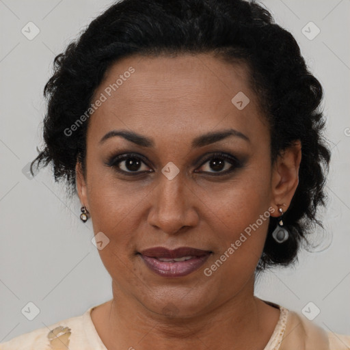 Joyful latino adult female with short  brown hair and brown eyes