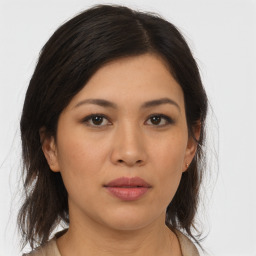 Joyful asian young-adult female with medium  brown hair and brown eyes