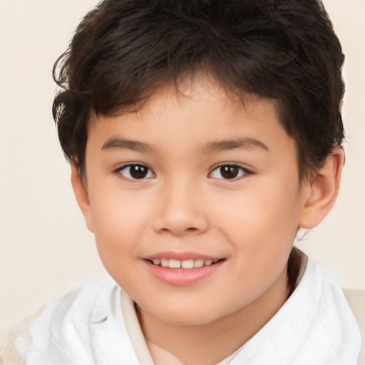 Joyful white child male with short  brown hair and brown eyes