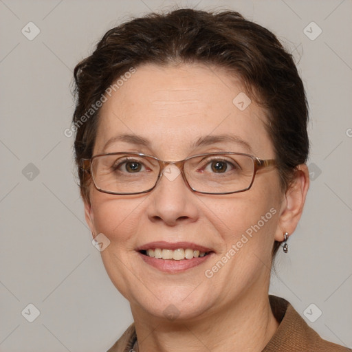 Joyful white adult female with short  brown hair and grey eyes