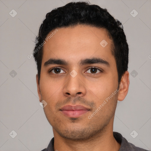 Neutral latino young-adult male with short  black hair and brown eyes