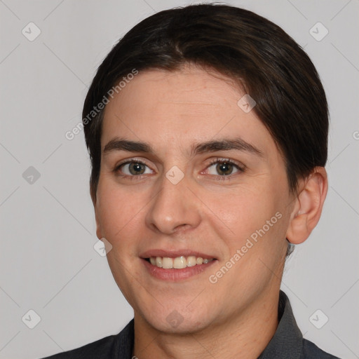 Joyful white adult male with short  brown hair and brown eyes