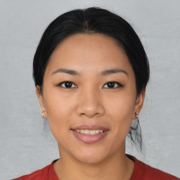 Joyful asian young-adult female with short  black hair and brown eyes