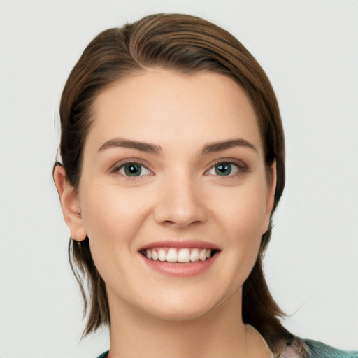 Joyful white young-adult female with medium  brown hair and grey eyes