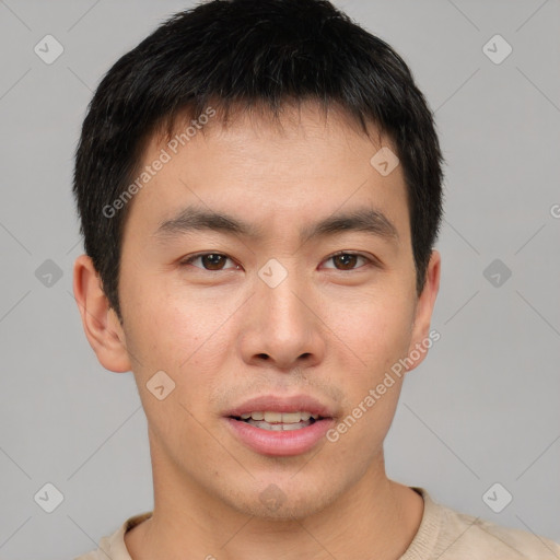 Joyful asian young-adult male with short  brown hair and brown eyes