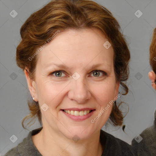 Joyful white adult female with medium  brown hair and blue eyes