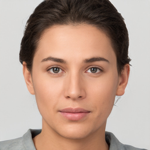 Neutral white young-adult female with short  brown hair and brown eyes