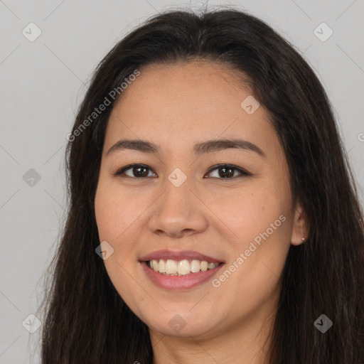 Joyful asian young-adult female with long  brown hair and brown eyes