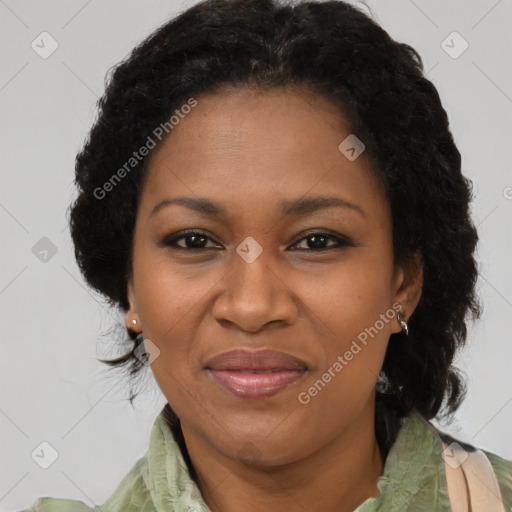 Joyful black adult female with medium  brown hair and brown eyes