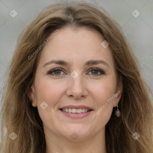 Joyful white adult female with long  brown hair and brown eyes