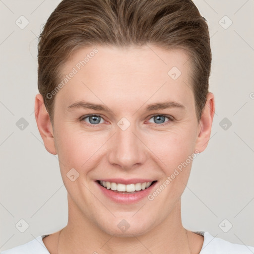 Joyful white young-adult female with short  brown hair and grey eyes