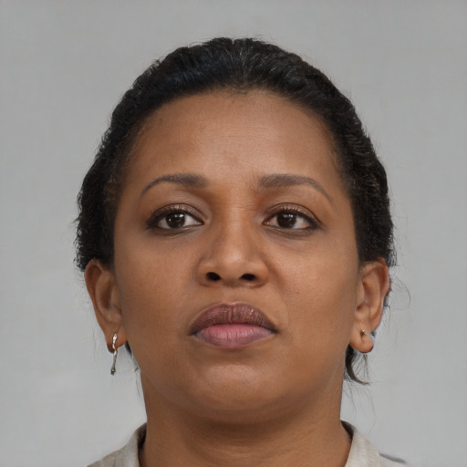 Neutral black young-adult female with short  brown hair and brown eyes