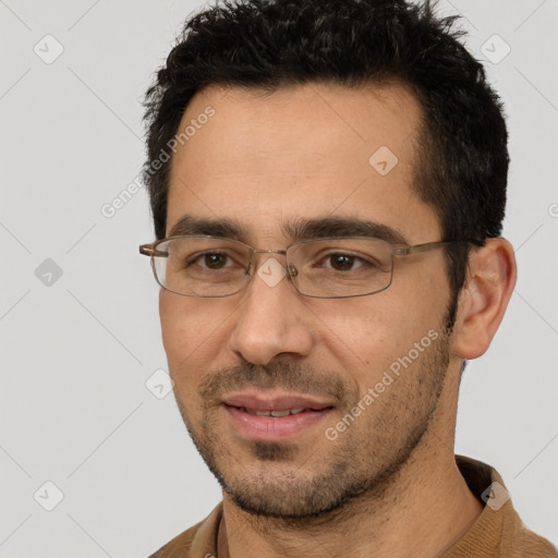 Joyful white young-adult male with short  black hair and brown eyes